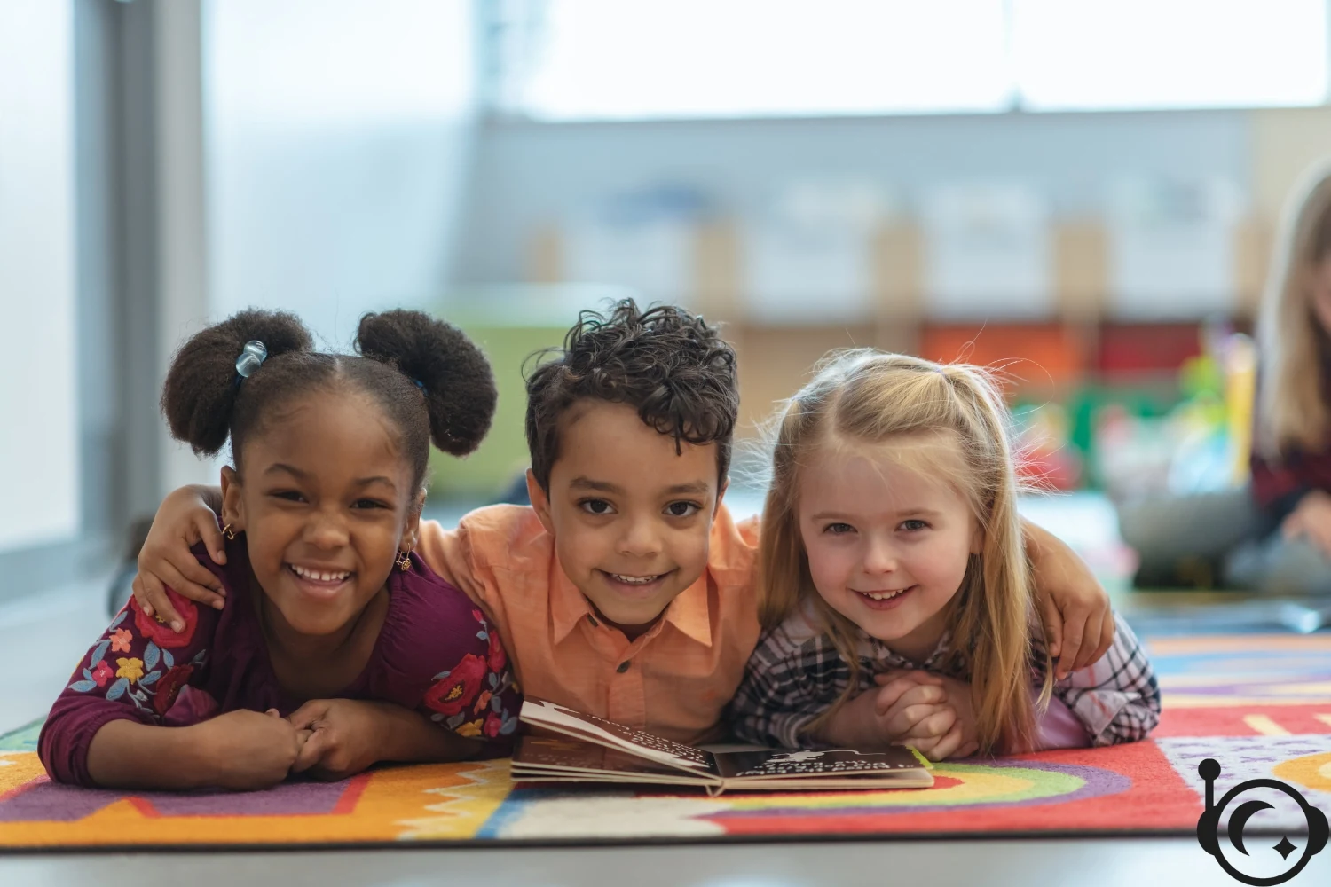 Children smiling together around books
