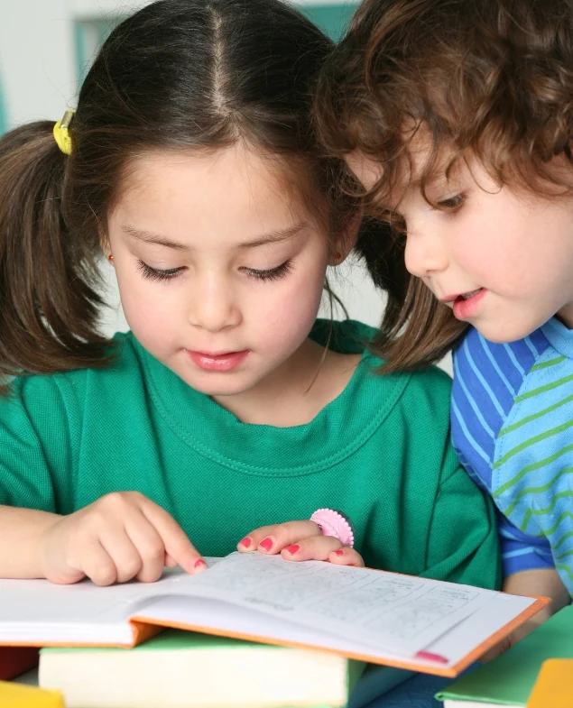 Children enjoying a book together